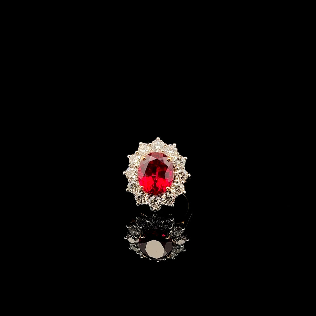 Floral Ruby Ring: Oval Gemstone in a Delicate Design