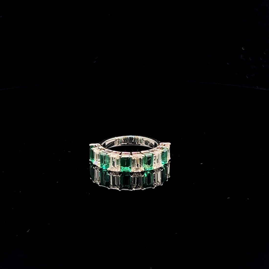 Intertwined Elegance: Emerald & diamond Half Eternity