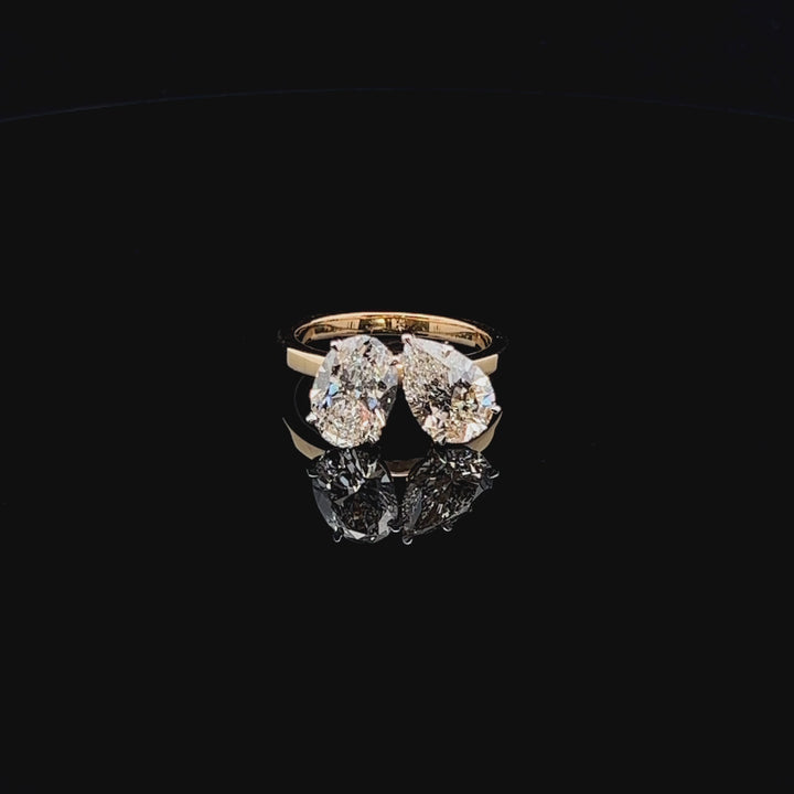 Toi et Moi Elegance: Oval & Pear Diamond Statement Ring
