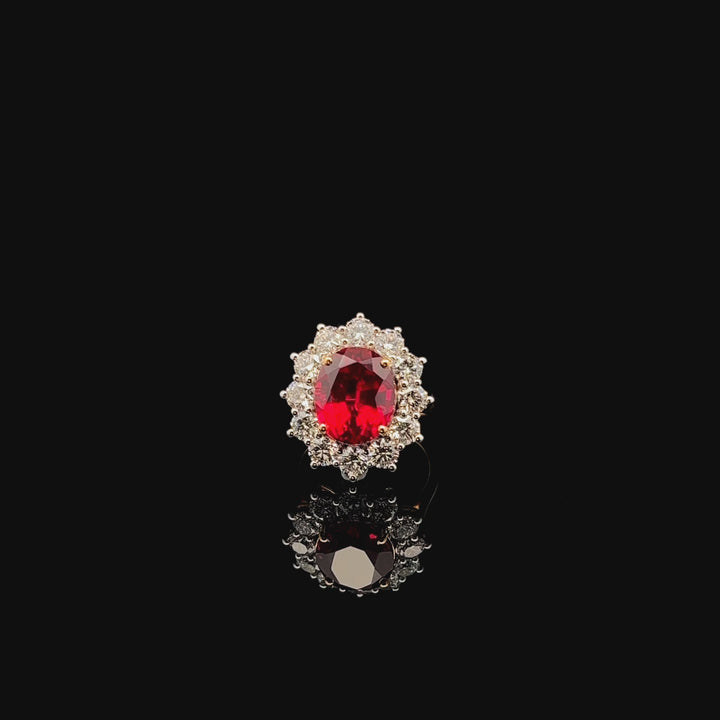 Floral Ruby Ring: Oval Gemstone in a Delicate Design
