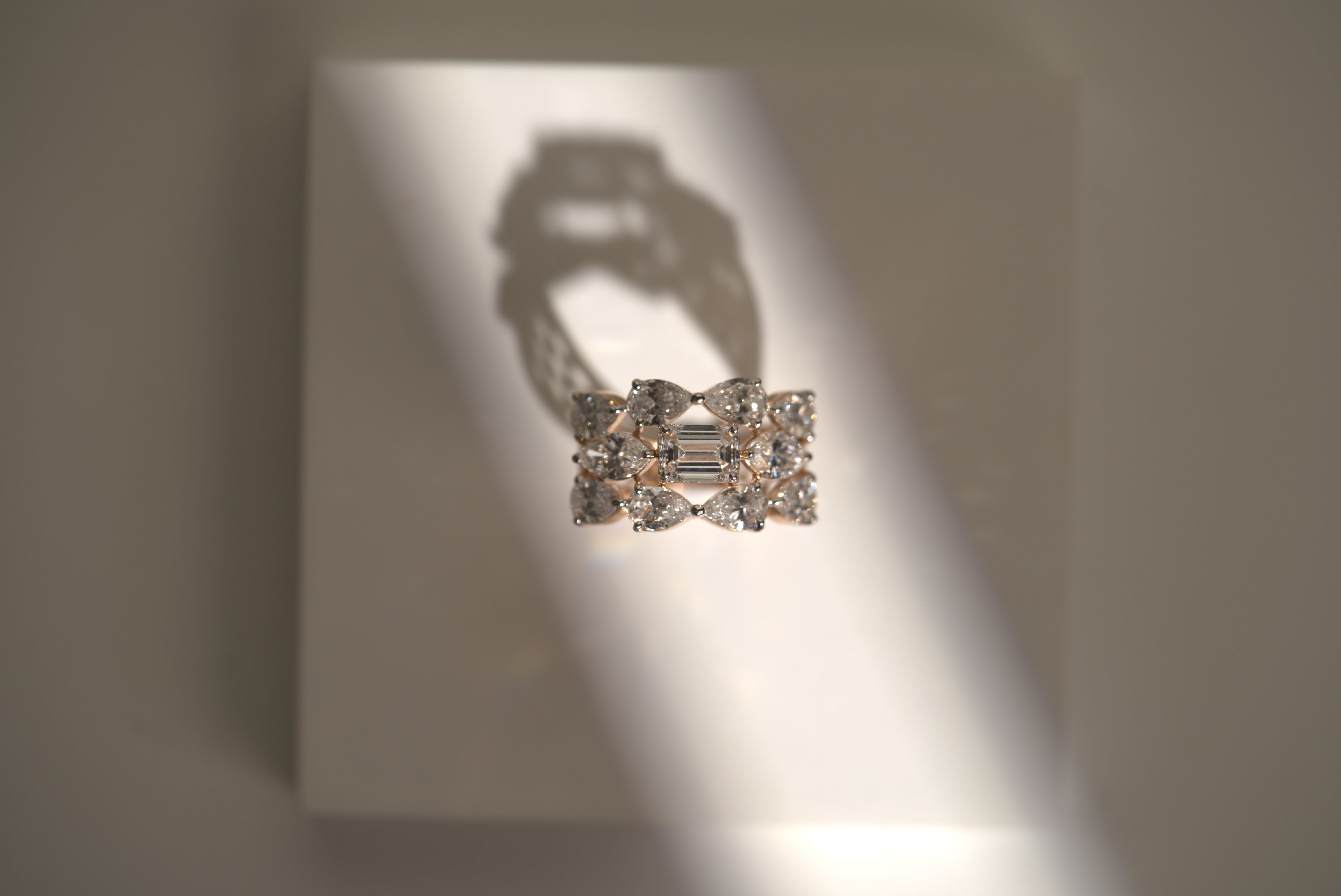 Emerald Elegance: Pear Diamond Accent Ring