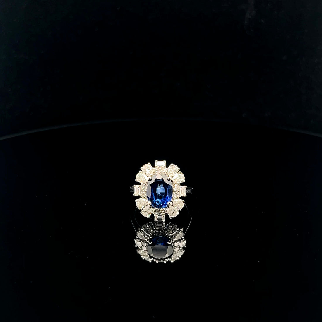 The Midnight Bloom: Oval Blue Gemstone Halo Ring