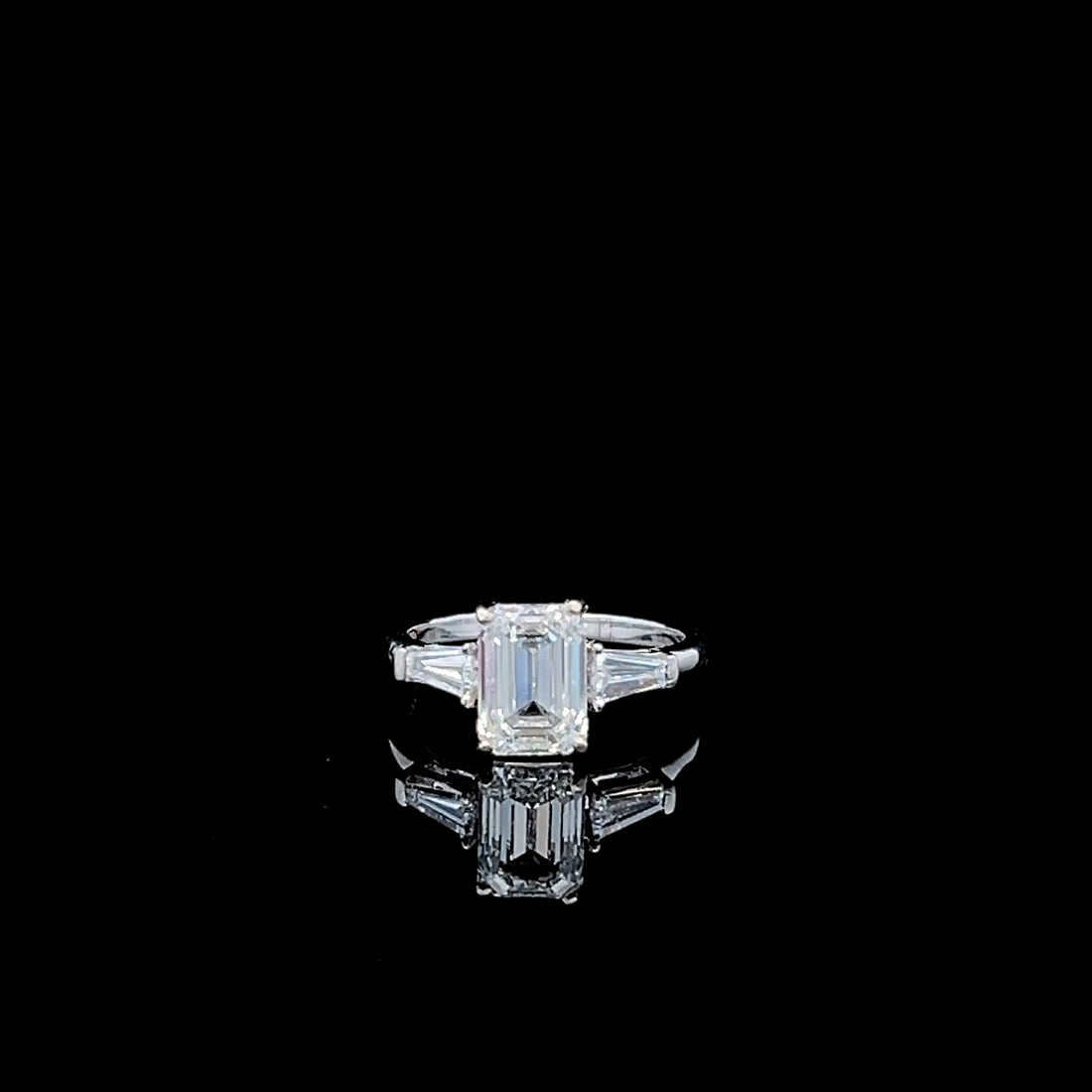 The Classic Professional: Emerald cut Diamond Three Stone Ring with Tapered Baguette Accents