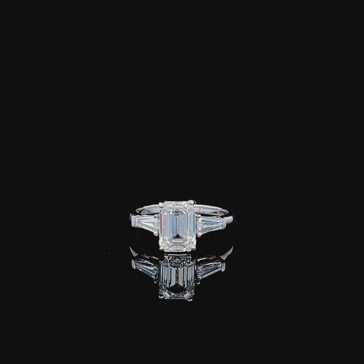 The Classic Professional: Emerald cut Diamond Three Stone Ring with Tapered Baguette Accents